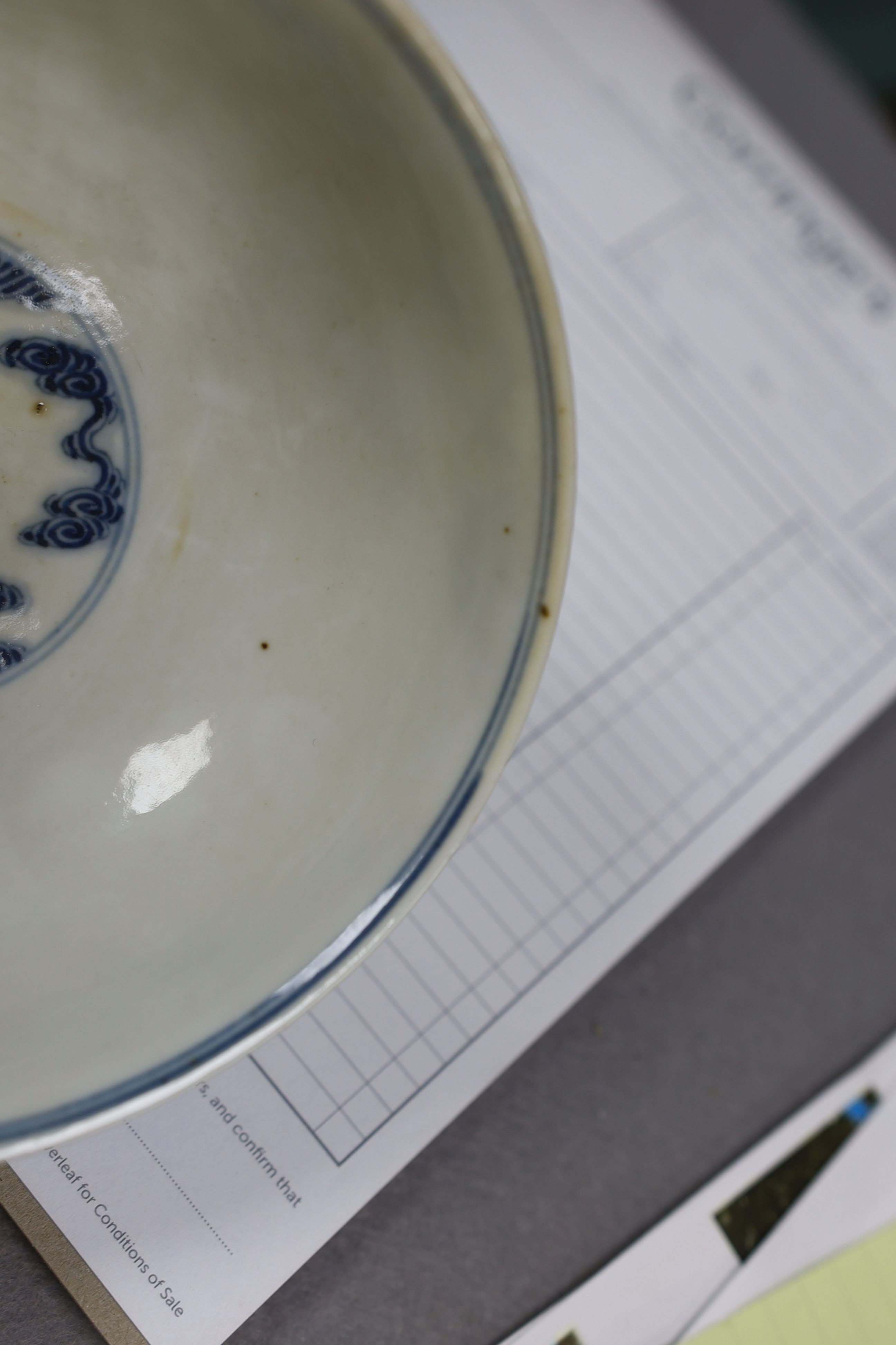 A pair of Chinese iron red and underglaze blue ‘five bat’ bowls, Guangxu mark and probably of the period (1875-1908), 16.5cm diameter